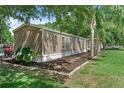 This home features low-maintenance landscaping, a side yard, and neutral siding at 12526 Spottswood Dr, Riverview, FL 33579