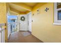 Charming condo entrance with decorative wreath and welcome mat at 370 8Th N Ave # 7, Tierra Verde, FL 33715