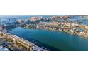 Aerial view showing waterfront community with various buildings, harbors, and boats at 800 S Gulfview Blvd # 403, Clearwater Beach, FL 33767