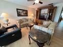 Inviting living room showcasing a comfortable seating arrangement and an elegant entertainment center at 1235 S Highland Ave # 3-303, Clearwater, FL 33756