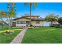 Inviting single-Gathering home with brick pathway and manicured lawn at 156 29Th N Ave, St Petersburg, FL 33704