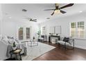 Bright living room with neutral decor, hardwood floors, and French doors to outdoor space at 156 29Th N Ave, St Petersburg, FL 33704