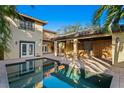 Beautiful backyard oasis with pool, outdoor kitchen, and covered patio at 156 29Th N Ave, St Petersburg, FL 33704