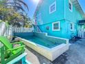Inviting pool area with tiled accents and a comfortable seating arrangement, ideal for relaxation at 308 2Nd St N # 202, Bradenton Beach, FL 34217