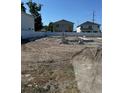 Vacant land showcasing a new foundation ready for building your dream home, bordered by a modern white fence at 3022 W Cass St, Tampa, FL 33609