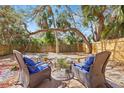 Backyard patio with comfortable seating around a fire pit, perfect for outdoor relaxation at 6211 S Macdill Ave # 1, Tampa, FL 33611