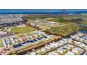 Wide aerial shot showing the neighborhood layout and the proximity to the water at 6538 Simone Shores Cir, Apollo Beach, FL 33572