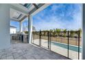 Outdoor pool area with a grill and a view of the sky at 6538 Simone Shores Cir, Apollo Beach, FL 33572