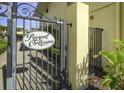 Entrance to Royal Orleans community with decorative gate and lush tropical landscaping at 16333 Gulf Blvd # 105, St Petersburg, FL 33708