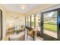 Cozy sunroom featuring tiled floors, ample natural light, and comfortable seating for relaxing and entertaining at 2546 Oakleaf Ln # 35D, Clearwater, FL 33763