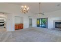 Spacious living room with vaulted ceiling, fireplace, and wet bar at 2567 Bentley Dr, Palm Harbor, FL 34684