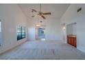 Open-concept living room with ample natural light and tile flooring at 2567 Bentley Dr, Palm Harbor, FL 34684