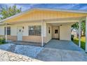 Welcoming single-story home with a covered carport and a tidy, stone-lined walkway at 540 Florida S Cir, Apollo Beach, FL 33572