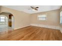 Bright living room with hardwood floors, an archway and ample natural light at 540 Florida S Cir, Apollo Beach, FL 33572
