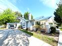 Lovely home featuring a well-maintained lawn, carport, and manicured landscaping at 14124 Plum Ln, Hudson, FL 34667