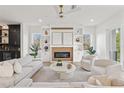 Bright living room boasts a modern fireplace, custom built-ins, and comfortable seating at 531 Danube Ave, Tampa, FL 33606