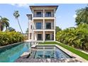 Backyard with a sparkling in-ground pool, perfect for relaxation and outdoor entertainment at 531 Danube Ave, Tampa, FL 33606