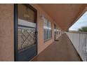 Exterior condo hallway with security door and access to units, emphasizing safety and privacy at 6400 46Th N Ave # 307, Kenneth City, FL 33709