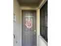 Charming unit front door adorned with a wreath and stylish hardware at 17520 Gawthrop Dr # 106, Lakewood Ranch, FL 34211