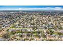 Expansive aerial view of a neighborhood showcasing neatly arranged homes and tree-lined streets at 3124 61St N Ln, St Petersburg, FL 33710