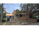 Two-story home under construction with a mix of modern design and traditional elements in a sunny, tree-lined neighborhood at 515 Bosphorous Ave, Tampa, FL 33606