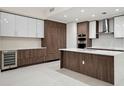 Bright kitchen with white countertops, stainless steel appliances and dark wood cabinetry at 301 1St S St # 1605, St Petersburg, FL 33701