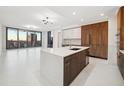 Modern kitchen featuring sleek white countertops, stainless steel appliances, and city views at 301 1St S St # 1605, St Petersburg, FL 33701