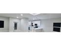 Bright and modern kitchen with white cabinets, sleek countertops and stainless steel appliances at 13224 Foresman Blvd, Port Charlotte, FL 33981