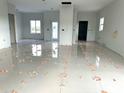Spacious living room with newly laid tile floors and abundant natural light at 13224 Foresman Blvd, Port Charlotte, FL 33981