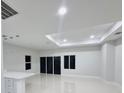 Bright living area with recessed lighting, and glass sliding doors that fill the room with natural light at 13224 Foresman Blvd, Port Charlotte, FL 33981