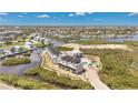 Stunning aerial view of the luxury townhomes with boat docks in a waterfront community at 2 Aqua Reserve Blvd, New Port Richey, FL 34652