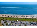 Breathtaking aerial view of a waterfront park with beach, green space, and parking at 1200 N Shore Ne Dr # 204, St Petersburg, FL 33701