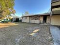 Side view of a single-story home with a carport and well-maintained lawn at 2120 57Th N Ave, St Petersburg, FL 33714