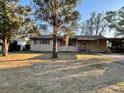 Single story home, featuring a covered carport and a green front yard at 2120 57Th N Ave, St Petersburg, FL 33714