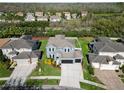 Expansive aerial view of the property showcasing the home's layout and landscaping at 4446 Wildstar Cir, Wesley Chapel, FL 33544