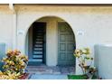 A condo entryway with a tiled floor and a view of the staircase at 6262 142Nd Ave # 506, Clearwater, FL 33760