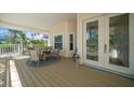 Inviting covered patio featuring a table and chairs for outdoor dining and relaxation at 14554 90Th Ave, Seminole, FL 33776