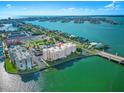 Beautiful aerial view of the condo building surrounded by ocean and city landscape at 500 Treasure Island Cswy # 308, Treasure Island, FL 33706