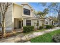 Inviting exterior of home featuring manicured landscaping, neutral colors, and a well-maintained walkway at 5100 Burchette Rd # 306, Tampa, FL 33647