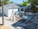 Backyard under construction showcases the concrete shell of a pool with a built in tanning ledge at 1119 26Th N Ave, St Petersburg, FL 33704