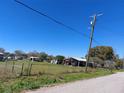 Large lot with a carport, fenced yard, and mature trees at 1115 27Th Se St, Ruskin, FL 33570