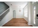 Dining area features wood floors, bright window and modern lighting at 11713 Summer Springs Dr, Riverview, FL 33579
