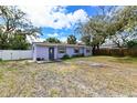 Inviting single-story home with a tidy lawn, showcasing a cozy and well-kept exterior at 3302 W Van Buren Dr, Tampa, FL 33611