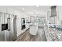 Bright kitchen with stainless steel appliances, center island and granite countertops at 1514 Sea Gull S Dr, St Petersburg, FL 33707