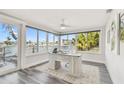 Bright office with a waterfront view, desk and chair, and large windows at 1514 Sea Gull S Dr, St Petersburg, FL 33707