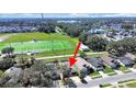 Aerial shot of property near an athletic field; manicured lawns and tree-lined streets add to the property's appeal at 2020 Cattleman Dr, Brandon, FL 33511