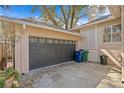 Spacious two-car garage with an automatic door and ample parking space on a concrete driveway at 4810 W San Miguel St, Tampa, FL 33629