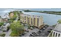 Aerial view of condo building showing parking and access to waterways and nearby neighborhoods at 5701 Mariner St # 606, Tampa, FL 33609