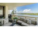 Relaxing balcony view featuring comfortable outdoor seating with a lovely bay view at 5701 Mariner St # 606, Tampa, FL 33609