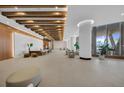 Bright, modern lobby features a reception area, comfortable seating and views of tropical foliage at 5120 Marina Way # 15006, Tampa, FL 33611